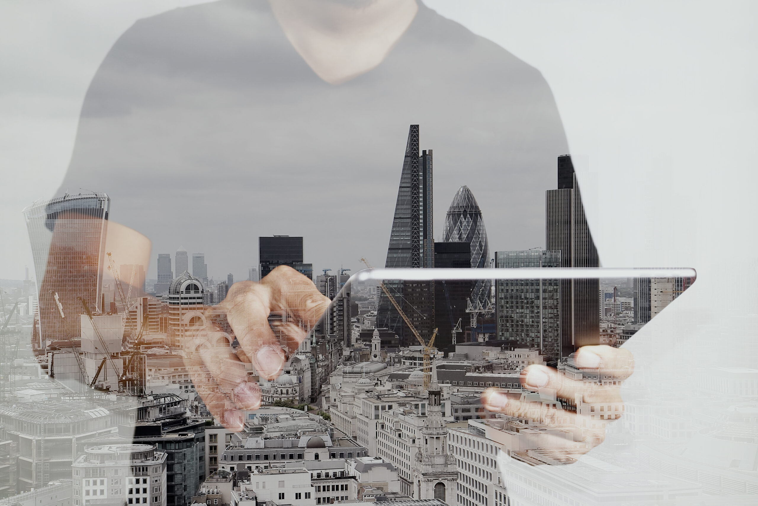 Double exposure of success businessman using digital tablet with